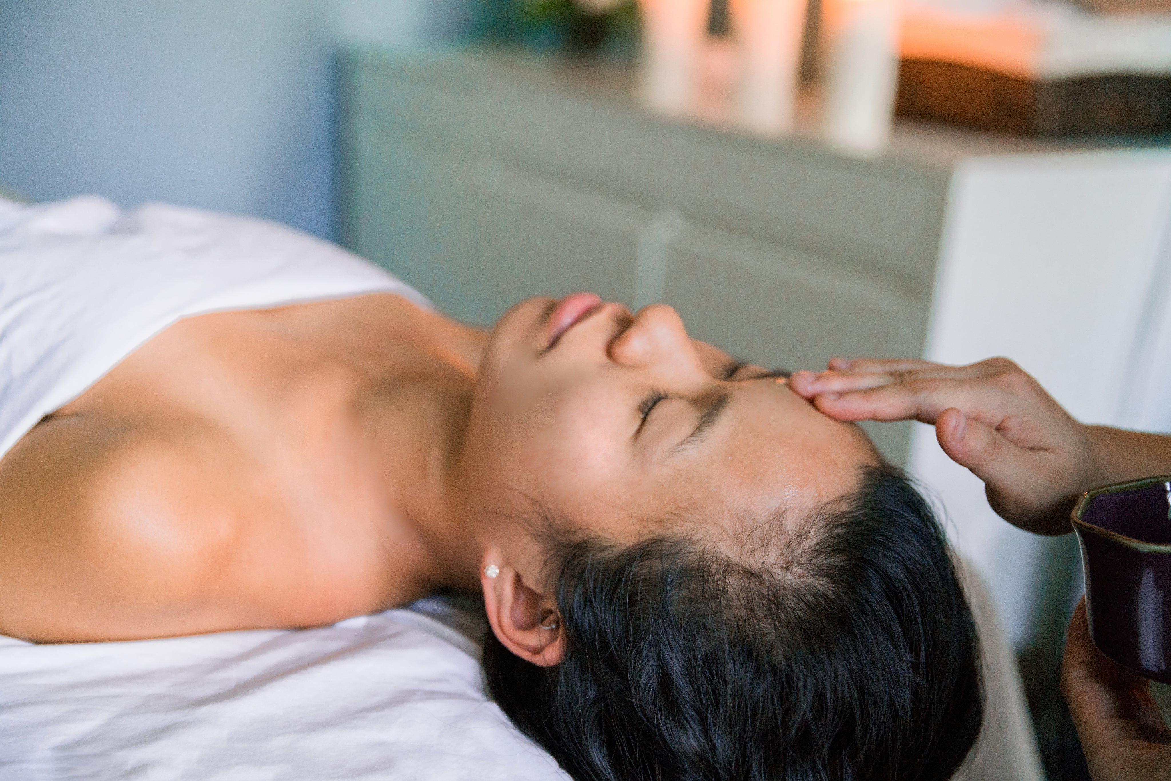 lady laid getting a facial treatment