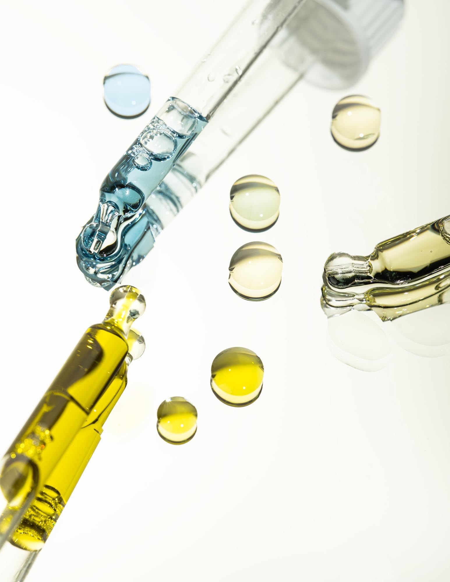 pipettes of oil laid flat with drops