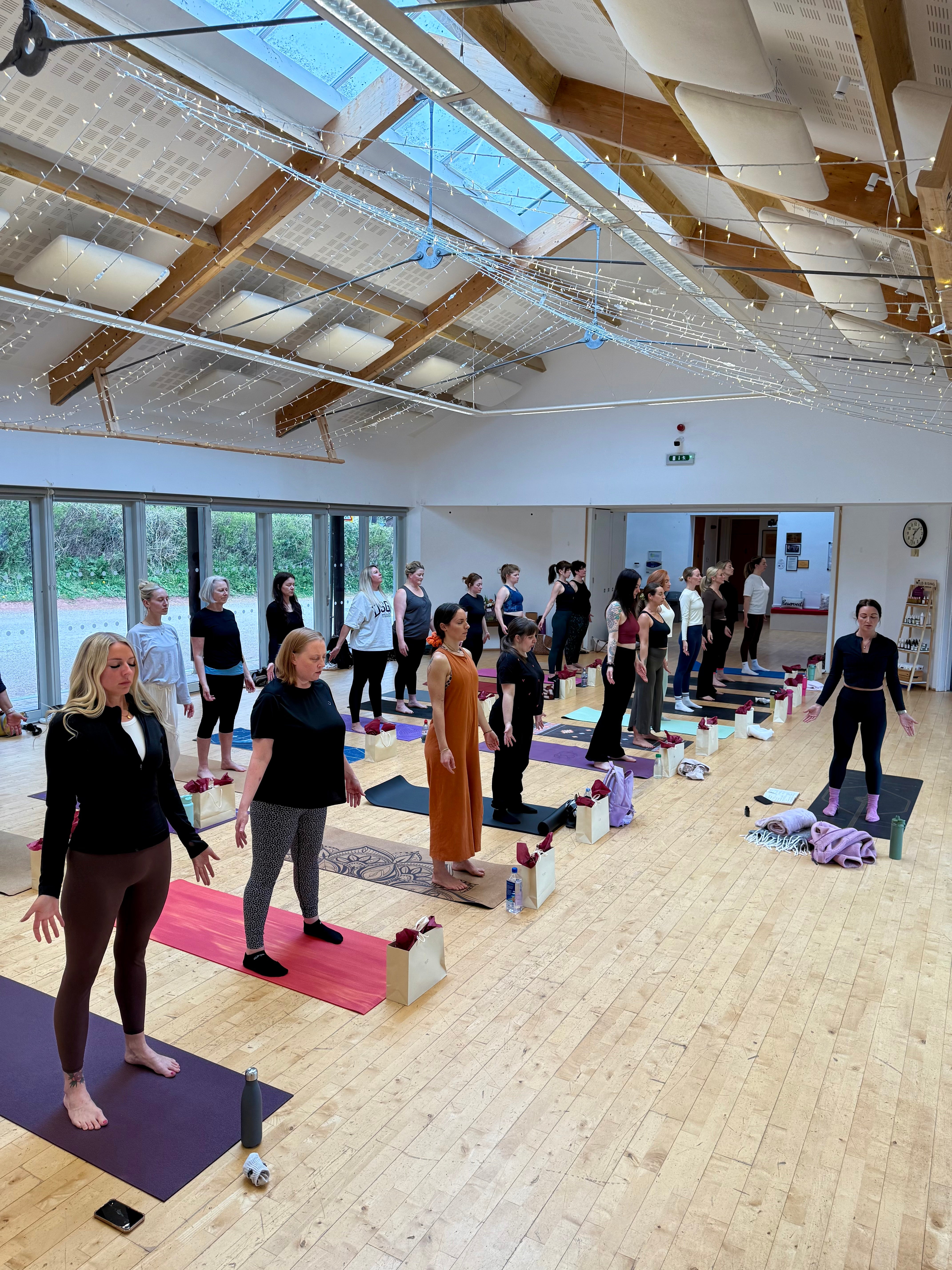group of women doing yoga tree pose
