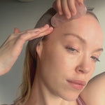 video of a girl using a facial massage gua sha
