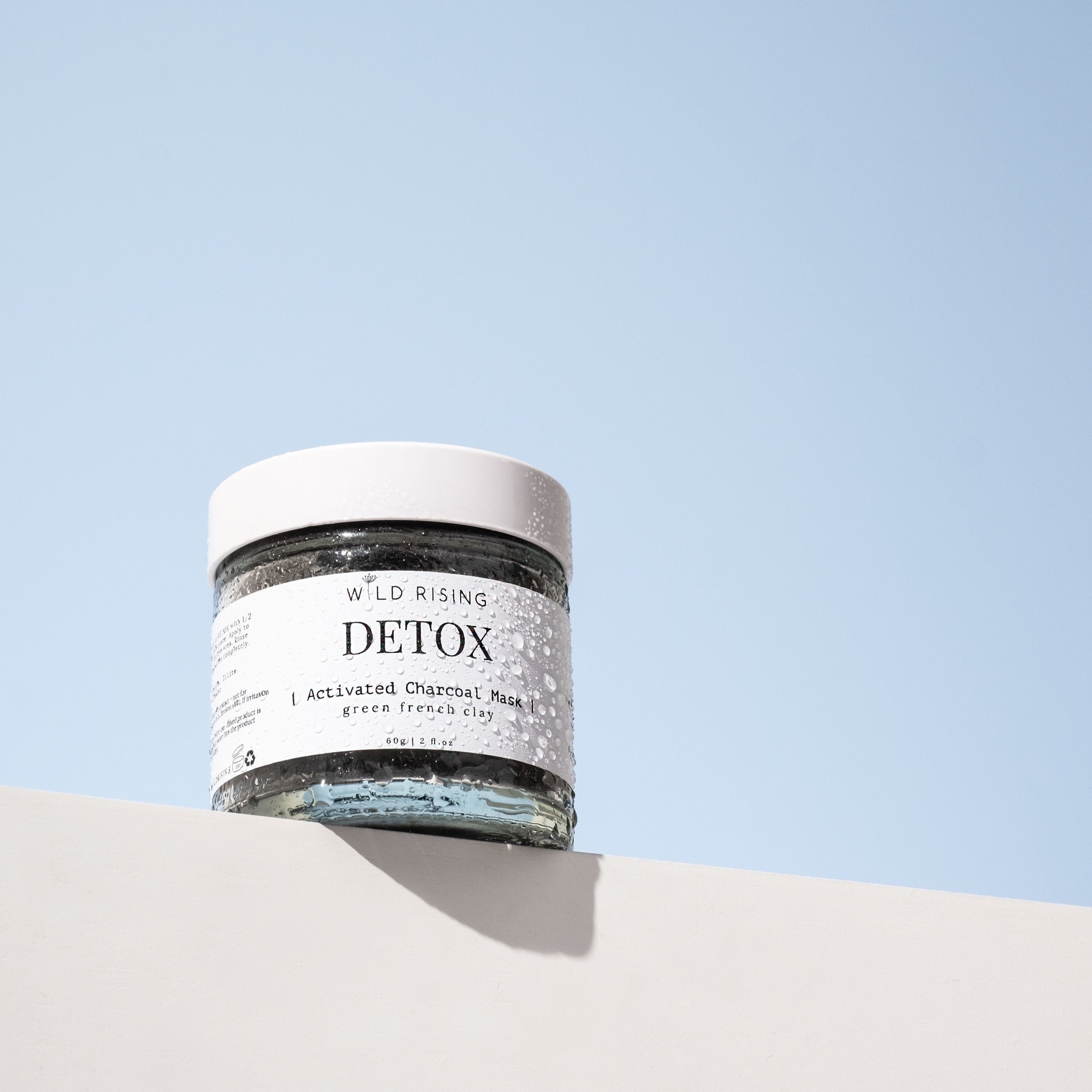 detox activated charcoal clay mask with water droplets