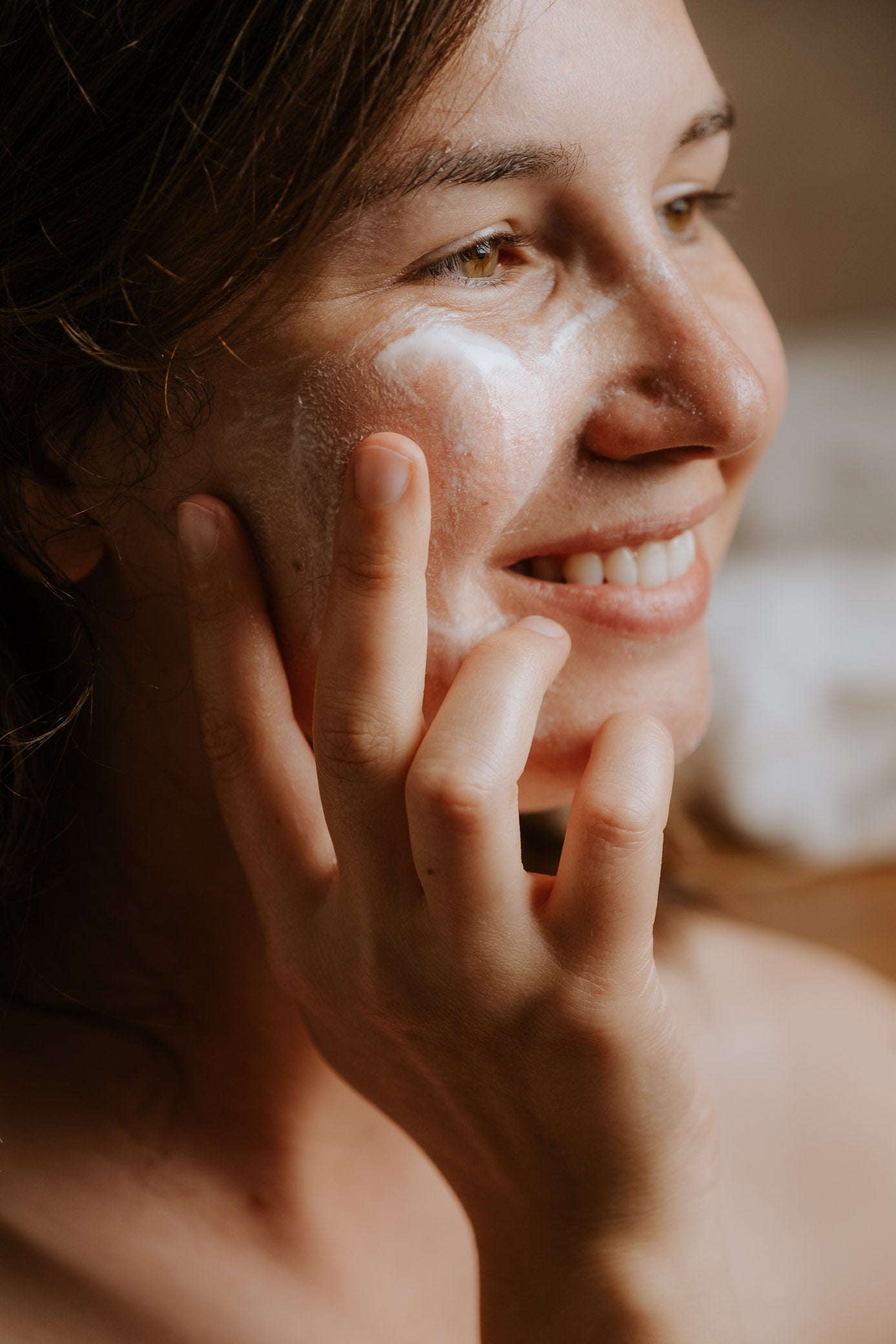 wild rising cream cleanser being used on the skin