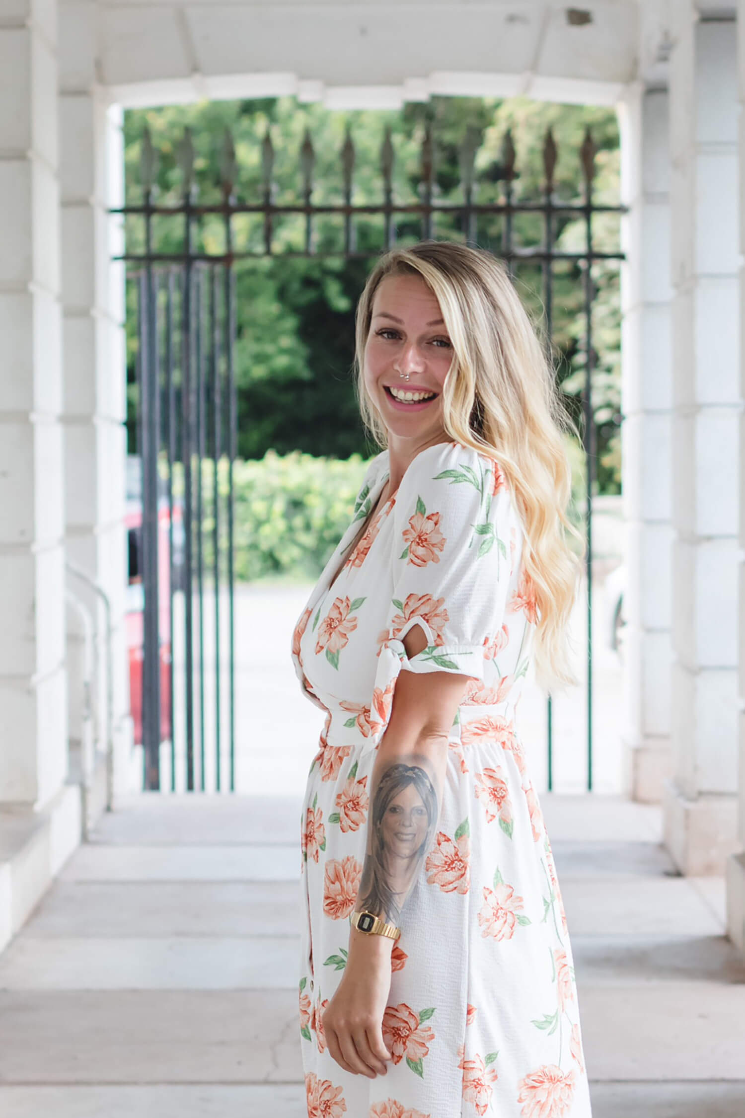 Danielle, founder of Wild Rising Skincare, smiling in summer dress