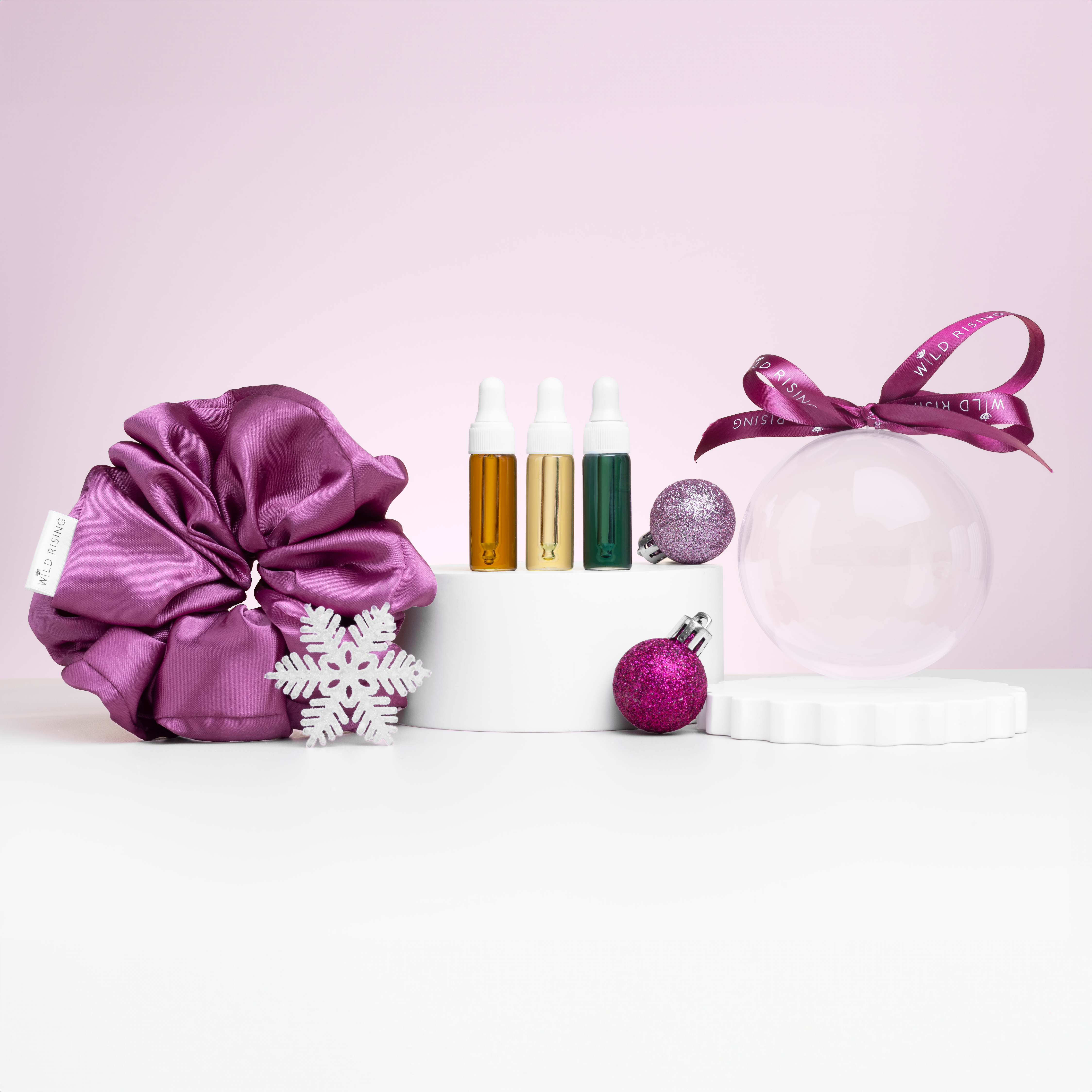 wild rising christmas beauty bauble with face oil and hair scrunchie