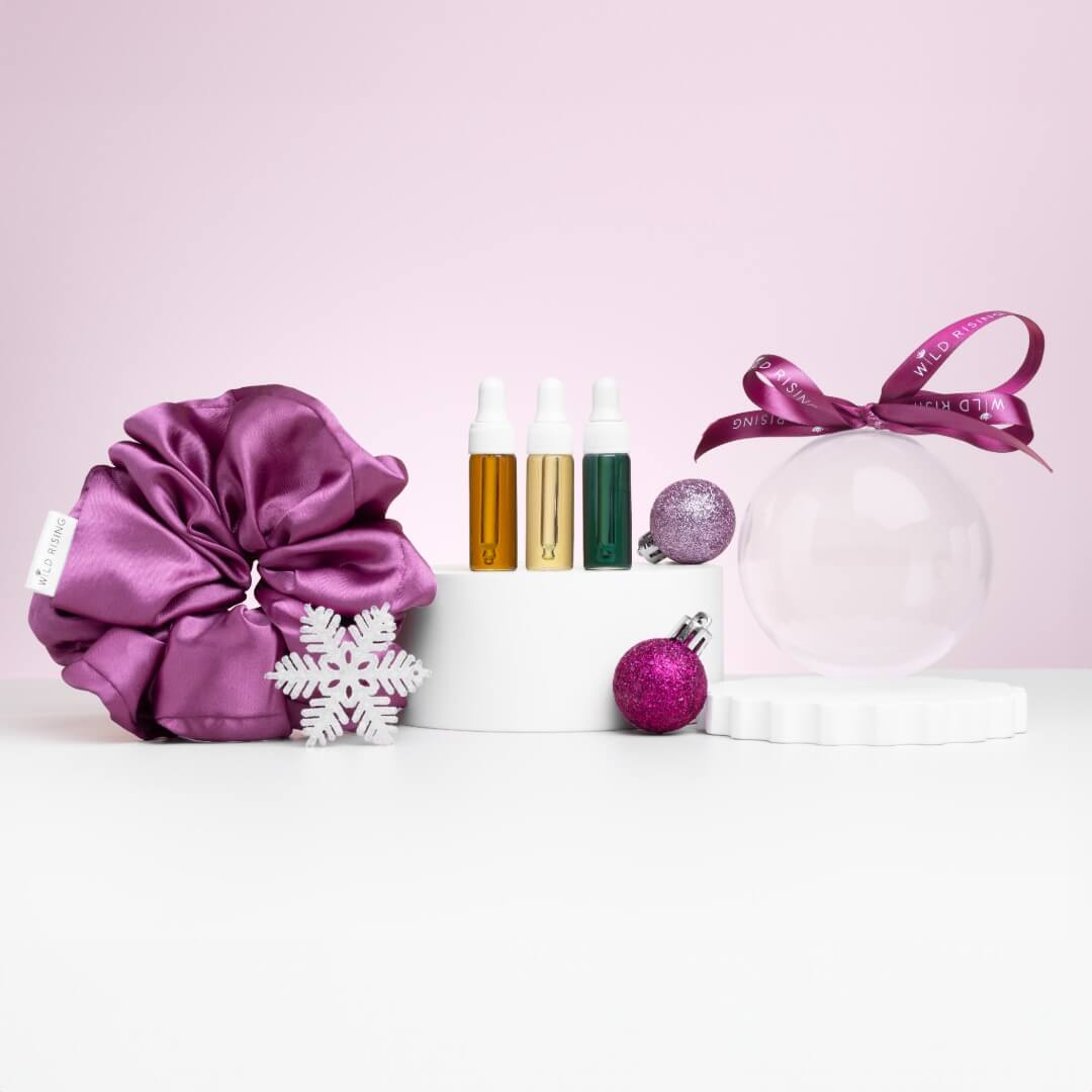 decorative bauble with the contents standing up nect to it