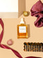Flat Lay of the Mane Event Christmas gIft Box featuring hair oil, comb and hair scrunchie