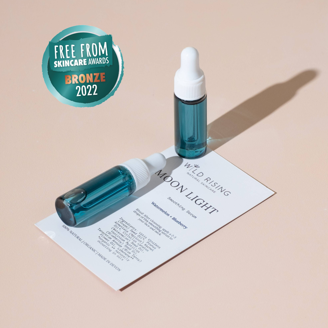 OneTwo blue dropper bottles with white caps on a beige background, featuring 'Free From Skincare Awards Bronze 2022' badge.
