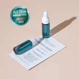 OneTwo blue dropper bottles with white caps on a beige background, featuring 'Free From Skincare Awards Bronze 2022' badge.
