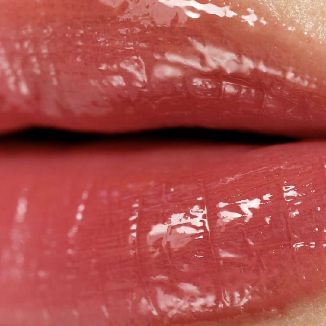 close of a lip showing texture of a lip oil