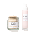 Two skincare products from Wild Rising on a white background: a clear glass jar of Naked Powder to Foam Cleaner with beige powder, and a pale pink pump bottle of Canvas Cream Cleaner.