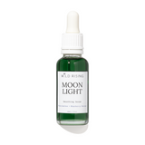 A bottle of Wild Rising Moon Light Smoothing Serum with a white dropper cap and a white label, containing a dark green liquid, set against a plain white background with a soft shadow.
