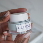 jar of face cream being held and used