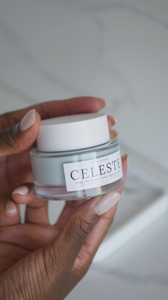 jar of face cream being held and used