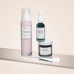 Three skincare products from Wild Rising on a beige surface with a light background