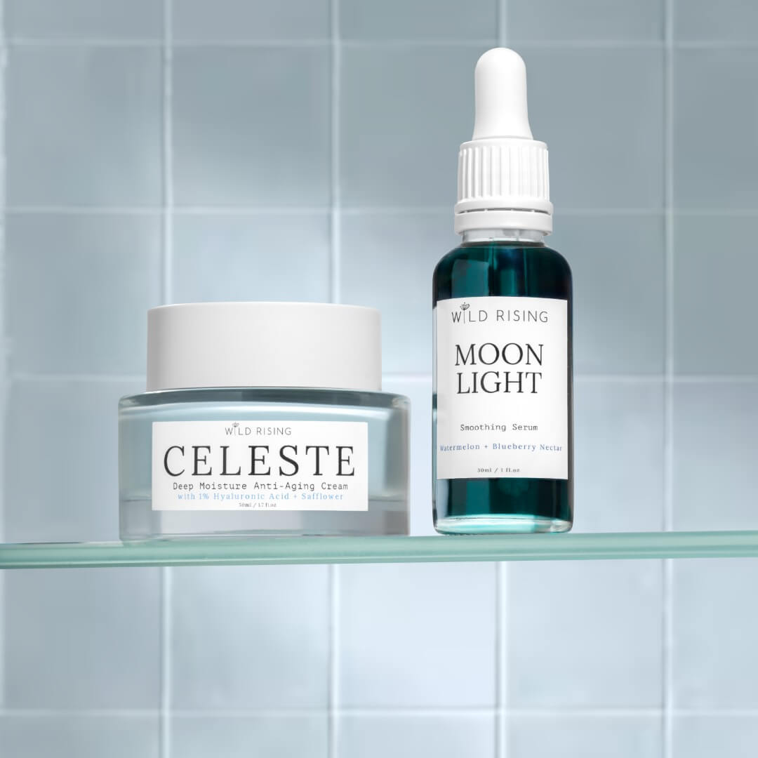 Two skincare products, a jar labeled 'Celeste' and a dropper bottle labeled 'Moon Light', on a glass shelf with a tiled wall background.