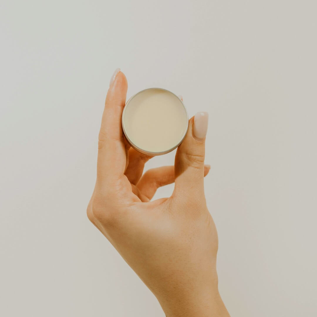 hand holding a lip balm