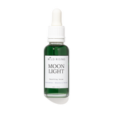 A bottle of Wild Rising Moon Light Smoothing Serum with a white dropper cap and a white label, containing a dark green liquid, set against a plain white background with a soft shadow.