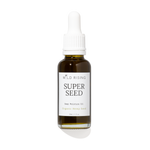 A 30ml glass dropper bottle of Wild Rising Super Seed Deep Moisture Oil, featuring an amber-colored bottle, a white dropper cap, and a white label with black text.