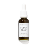 A 30ml glass dropper bottle of Wild Rising Super Seed Deep Moisture Oil, featuring an amber-colored bottle, a white dropper cap, and a white label with black text.