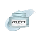 A clear cosmetic jar of Wild Rising Celeste Deep Moisture Anti-Aging Cream with a white label, shown with a pale icy blue cream smear behind it on a white background.