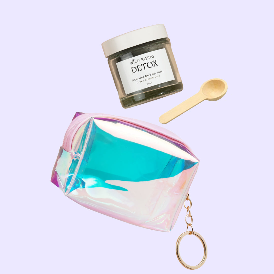 Detox product with a colorful container and wooden spoon on a light purple background