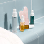 mini moisturisers on a blue tiled background