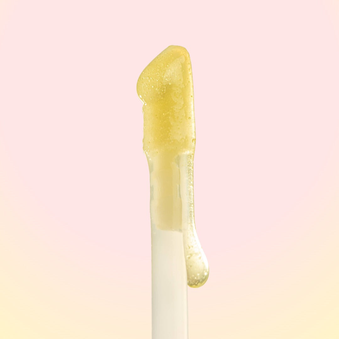 Yellow gel-like substance on a pink background