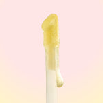 Yellow gel-like substance on a pink background