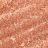 Close-up of pinkish salt scrub textured surface