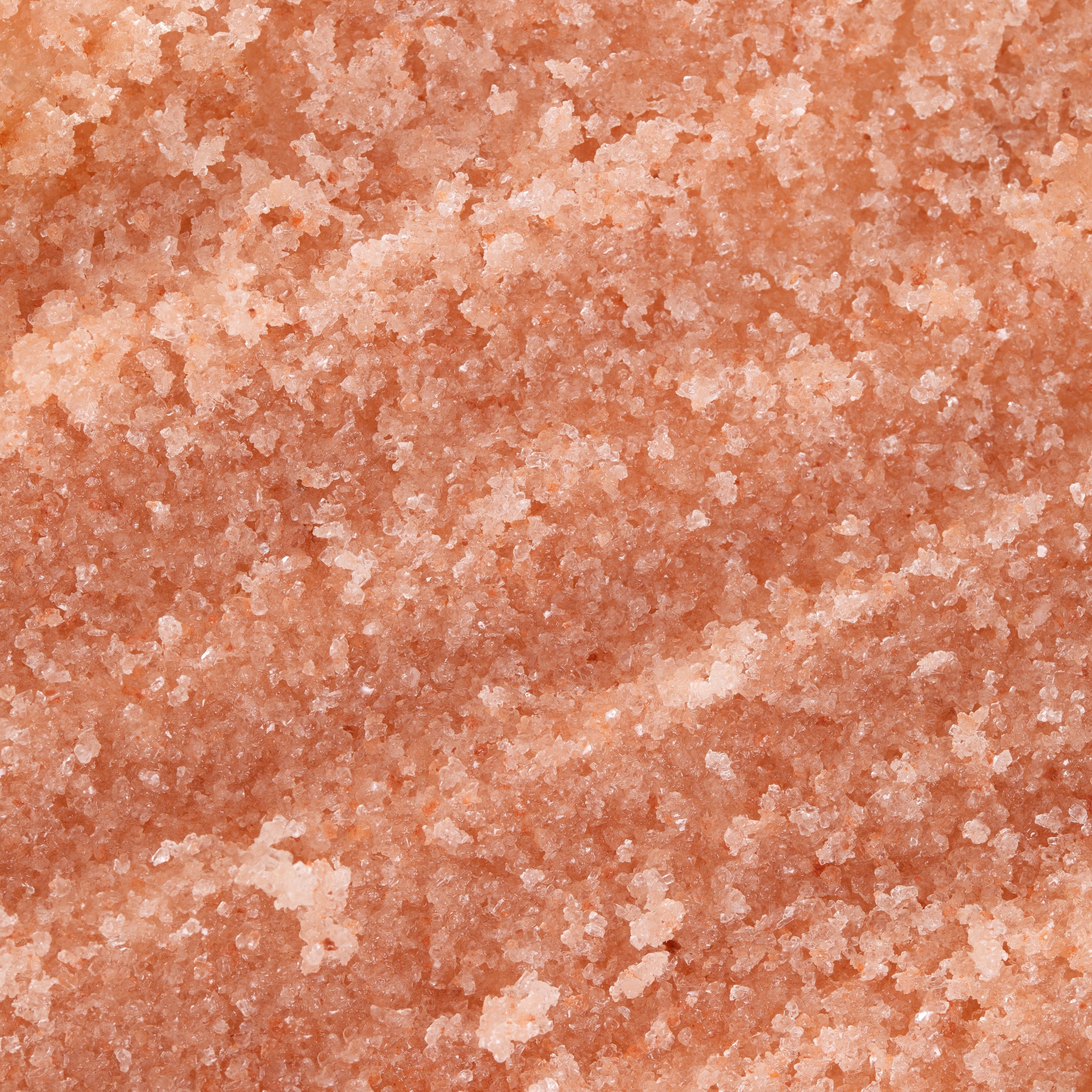 Close-up of pinkish salt scrub textured surface