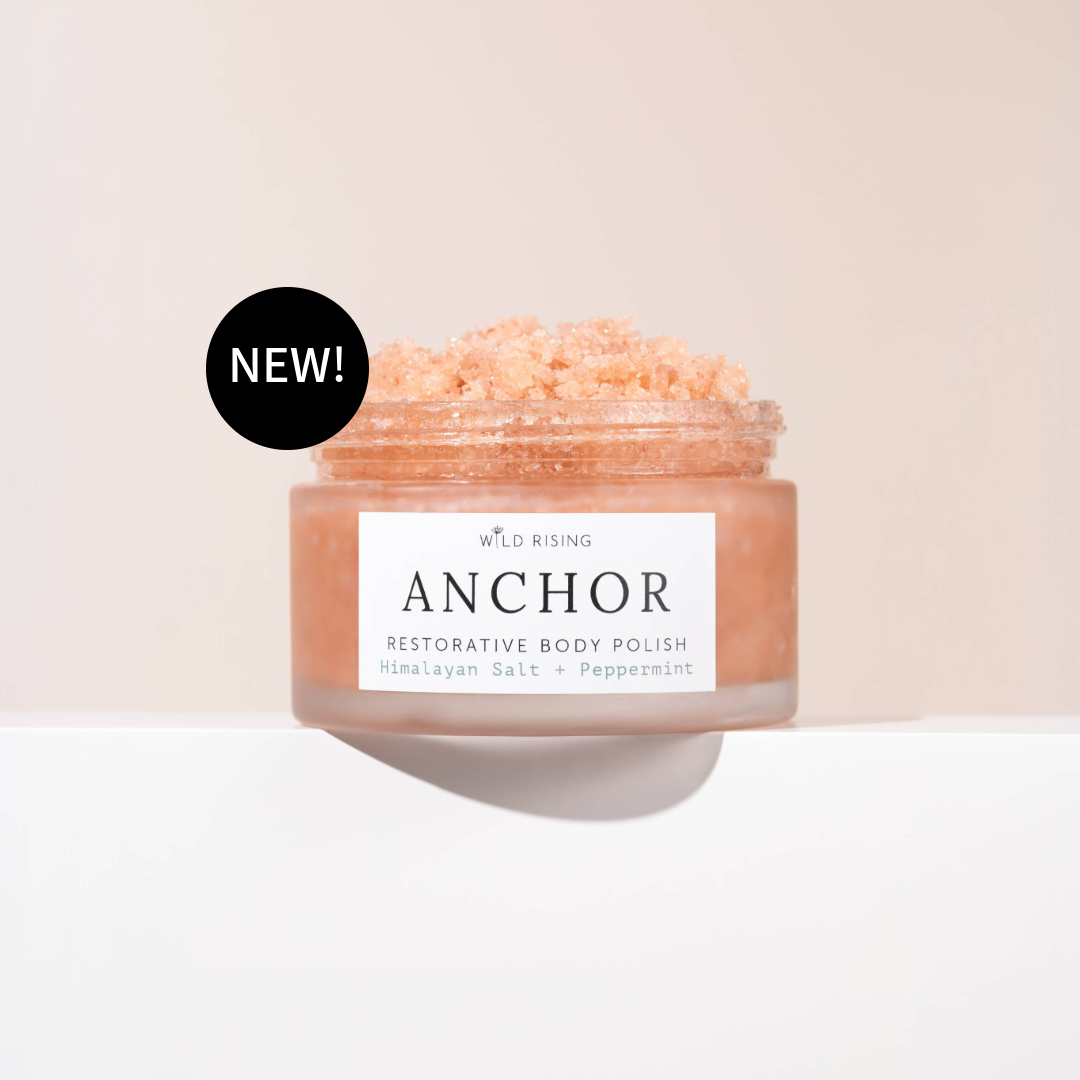 Jar of 'Anchor' restorative body polish with a 'NEW!' label on a beige background