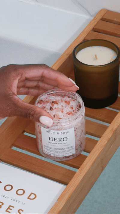 video of a hand pinching bath salts and putting it in the bath