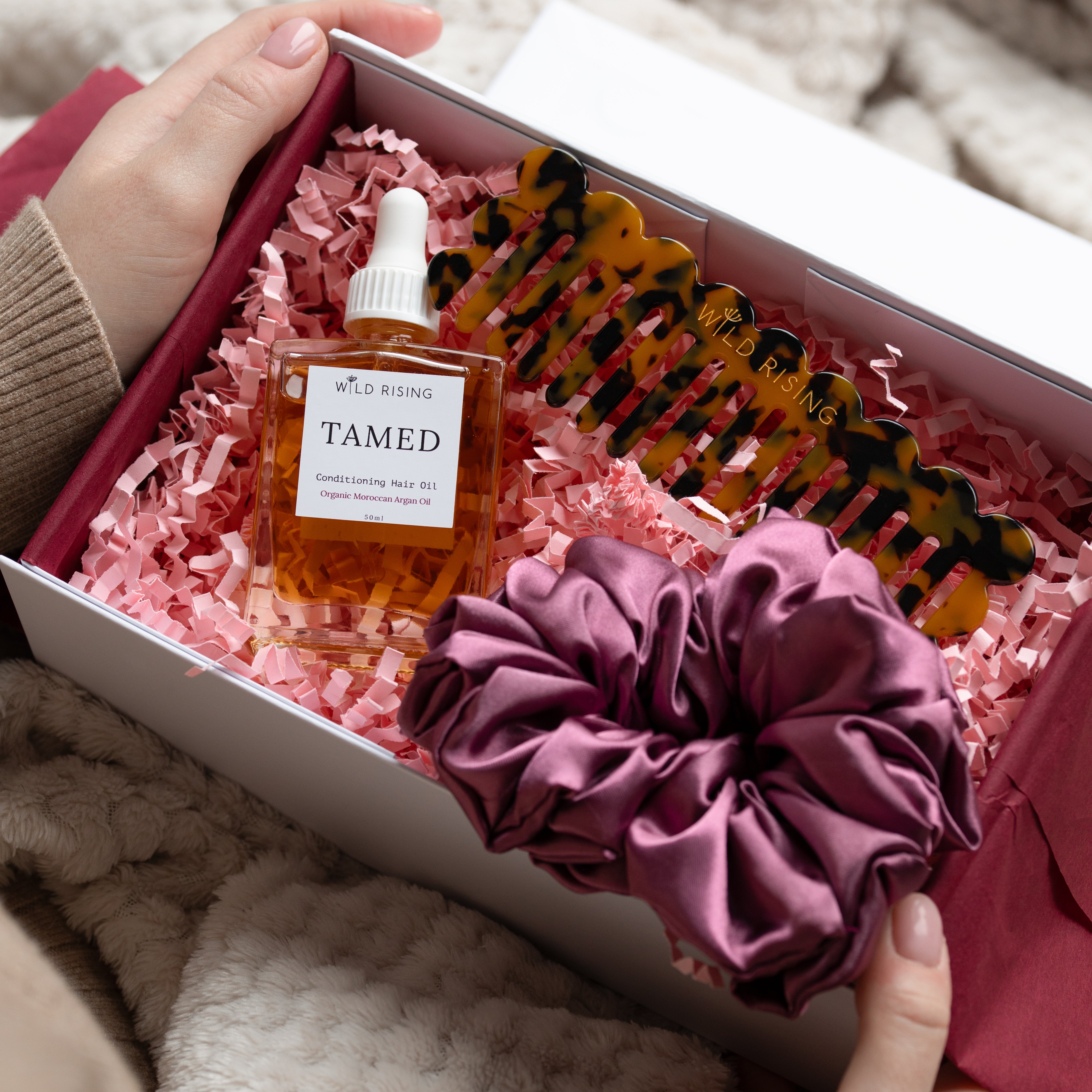 gift box with hair oil, comb and scrunchie