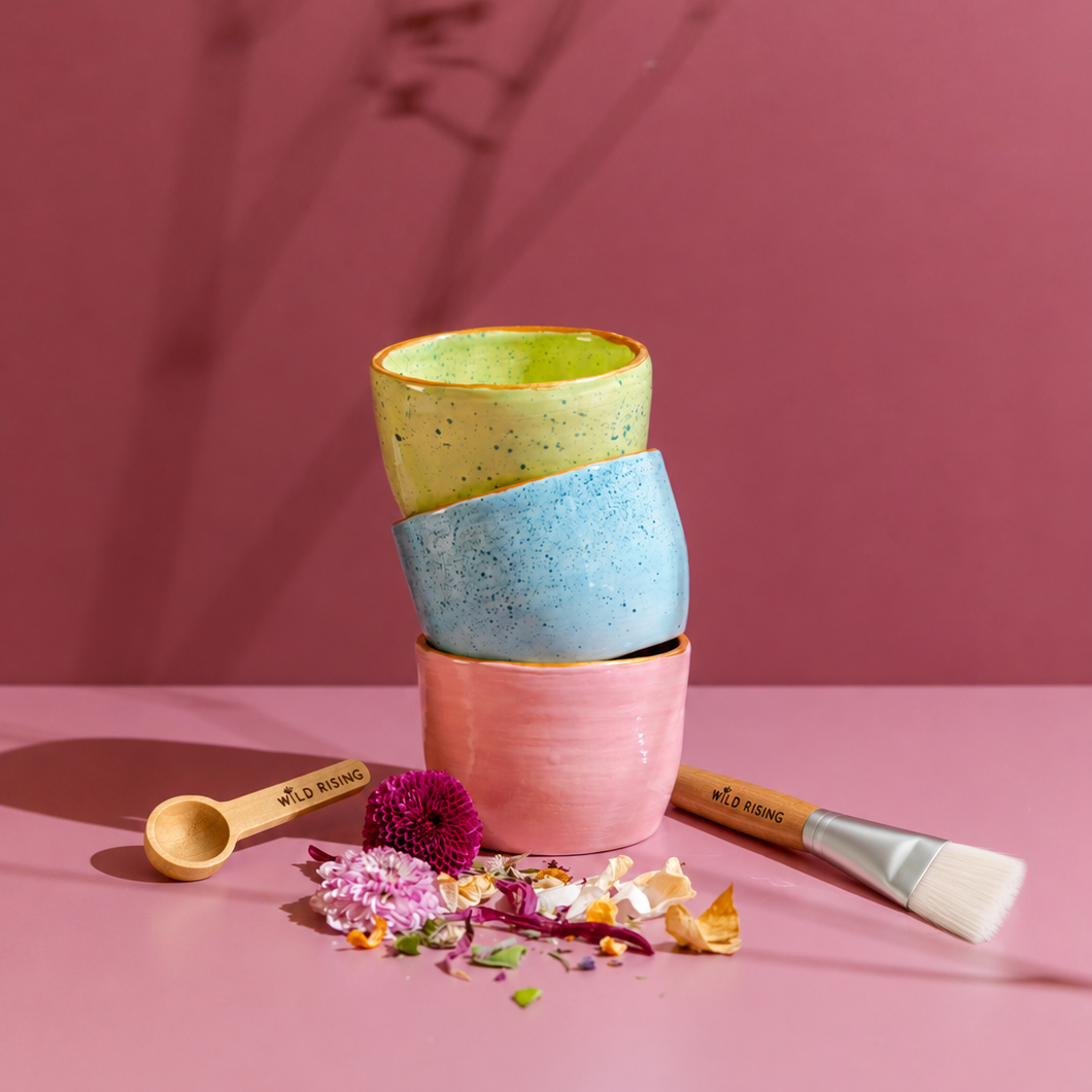 green, blue and pink bowl with brush and spoon