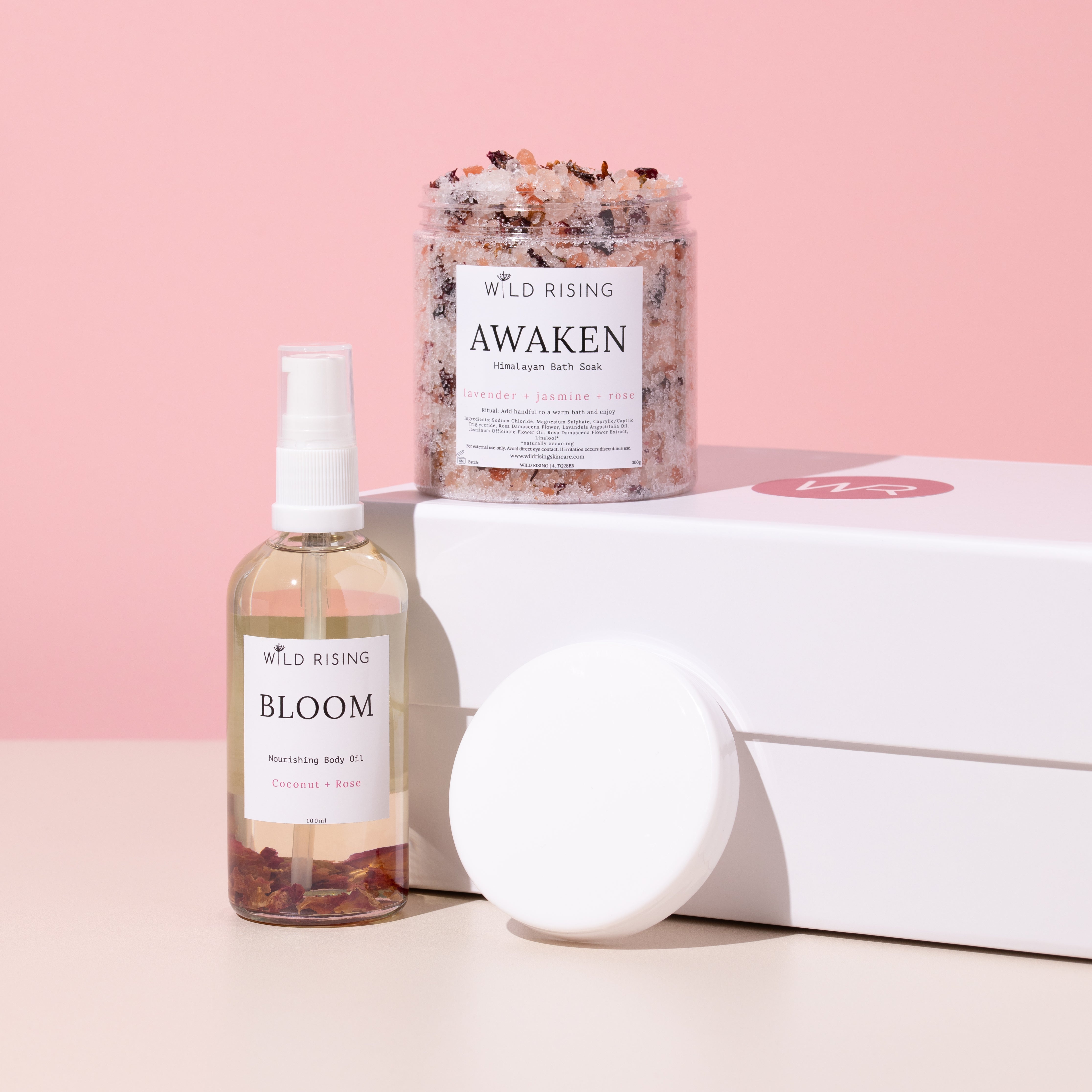 body oil and bath salts stood on a gift box