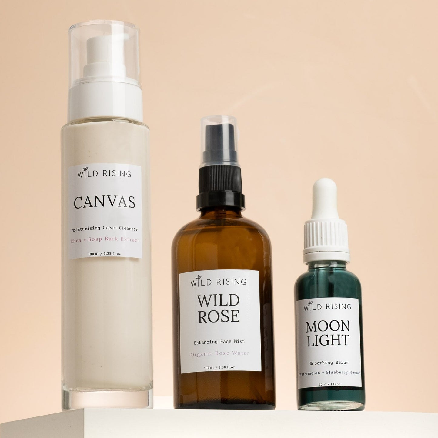 Canvas cream cleanser, wild rose organic rose water toner and moonlight blue tansy face oil stood together