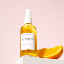 coconut and Orange Body Bath Oil with orange segment