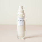 canvas cream cleanser with cream dripping down the bottle