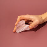 rose quartz gua sha wild rising model holding