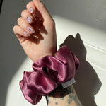 wild rising hair scrunchie on wrist