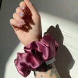 wild rising hair scrunchie on wrist